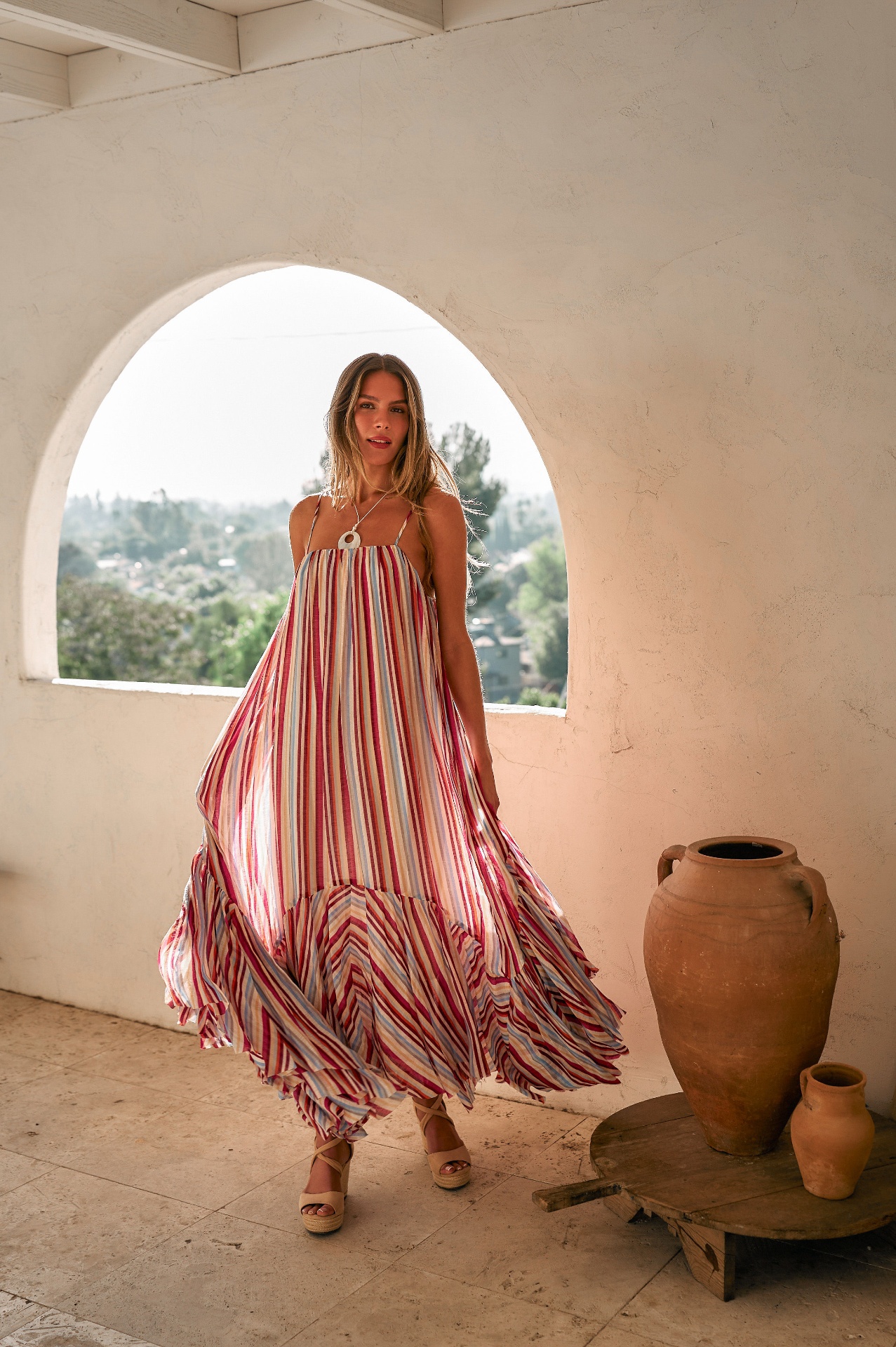 Striped maxi dress in arched window